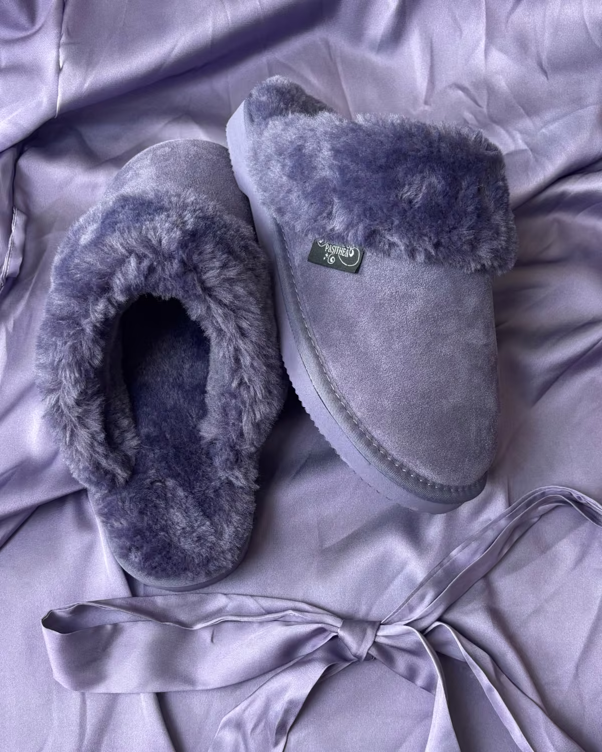 The Elysian in Lavender Fog, soft violet shearling slippers on lavender satin