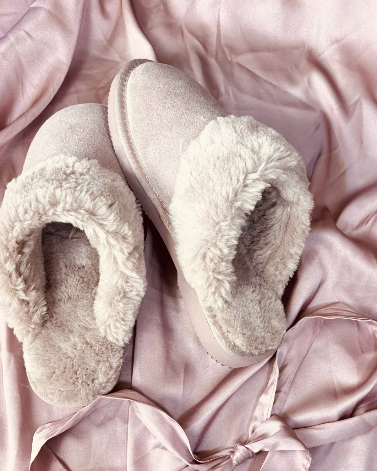 The Elysian in Rosewater, pale pink shearling slippers on blush satin